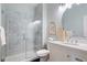 Modern bathroom with a marble shower, vanity with decorative accents, and updated fixtures at 415 Butte Pkwy, Golden, CO 80403
