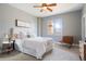 Cozy bedroom featuring a plush bed, neutral decor, and a window offering natural light at 415 Butte Pkwy, Golden, CO 80403