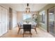 Bright dining room featuring modern lighting and a large window with mountain views at 415 Butte Pkwy, Golden, CO 80403