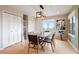 Elegant dining room featuring modern décor and a large window with a view at 415 Butte Pkwy, Golden, CO 80403
