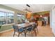 Open dining room with mountain views, decorative lighting, and hardwood floors at 415 Butte Pkwy, Golden, CO 80403