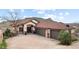 Charming single-story home with a three-car garage, stone accents, and a red tile roof at 415 Butte Pkwy, Golden, CO 80403