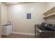 Functional laundry room with modern appliances, a utility sink, and ample storage space at 415 Butte Pkwy, Golden, CO 80403