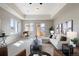 Inviting living room with tray ceilings, modern decor, and access to a private balcony at 415 Butte Pkwy, Golden, CO 80403