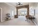 Open living room with stone archway, natural light, and scenic views from balcony at 415 Butte Pkwy, Golden, CO 80403