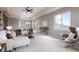 Spacious living room with stone accent wall, modern furniture, and large windows offering scenic views at 415 Butte Pkwy, Golden, CO 80403