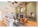Spacious living room featuring a stone fireplace, vaulted ceilings, and abundant natural light at 415 Butte Pkwy, Golden, CO 80403