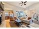 Bright open-concept living room connecting to the kitchen, featuring wood floors and modern finishes at 415 Butte Pkwy, Golden, CO 80403