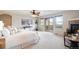Bright main bedroom with fireplace, balcony access, and views of surrounding hills at 415 Butte Pkwy, Golden, CO 80403