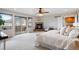 This spacious bedroom offers a fireplace, a ceiling fan, and a private balcony at 415 Butte Pkwy, Golden, CO 80403