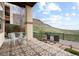 Inviting outdoor patio with comfortable seating and views of the surrounding landscape at 415 Butte Pkwy, Golden, CO 80403