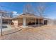 Backyard detached structure with covered patio and ample space at 3515 Grape St, Denver, CO 80207