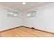 Cozy bedroom with natural light, hardwood floors, and neutral paint at 3515 Grape St, Denver, CO 80207