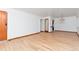Open living room featuring beautiful hardwood floors, white walls and natural light at 3515 Grape St, Denver, CO 80207