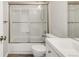 Bright bathroom featuring a tub, shower, and single sink at 10591 Hyacinth St, Highlands Ranch, CO 80129