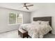 Bedroom with ceiling fan, neutral paint, carpet flooring and view to the outdoors at 10591 Hyacinth St, Highlands Ranch, CO 80129