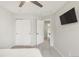 Bedroom with gray carpet, a TV, closet, and access to the hall at 10591 Hyacinth St, Highlands Ranch, CO 80129