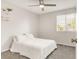 Neutral bedroom with natural light, ceiling fan, and carpet at 10591 Hyacinth St, Highlands Ranch, CO 80129