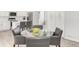 Dining area with views of the kitchen, featuring a glass table and modern chairs at 10591 Hyacinth St, Highlands Ranch, CO 80129