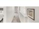 Hallway with gray carpet and views of bedrooms at 10591 Hyacinth St, Highlands Ranch, CO 80129