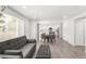 Open-concept living room flows into the kitchen, featuring wood floors and a modern design at 10591 Hyacinth St, Highlands Ranch, CO 80129