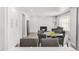 Bright living room with modern fireplace, hardwood floors and neutral color palette at 10591 Hyacinth St, Highlands Ranch, CO 80129
