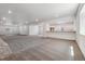 Expansive finished basement featuring neutral carpeting, recessed lighting, and a convenient wet bar area at 8672 Pennycress Dr, Littleton, CO 80125