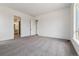 Bright bedroom with multiple doorways and windows, featuring plush carpeting and ample natural light at 8672 Pennycress Dr, Littleton, CO 80125