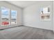 Spacious bedroom featuring neutral carpet, white walls, and several windows offering lots of natural light at 8672 Pennycress Dr, Littleton, CO 80125