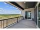 Spacious deck with railing, offering scenic views of the surrounding landscape at 8672 Pennycress Dr, Littleton, CO 80125
