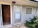 Back porch with siding, a window, door, and foliage at 3910 E Orchard Rd, Centennial, CO 80121