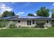 Backyard view of home showing solar panels, sliding glass door, and large lawn in a quiet, residential neighborhood at 3910 E Orchard Rd, Centennial, CO 80121