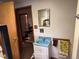 Basement bathroom with vintage sink and dated fixtures needing remodeling at 3910 E Orchard Rd, Centennial, CO 80121