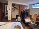 Angle view of basement bedroom, showcasing closet, clutter, and general layout at 3910 E Orchard Rd, Centennial, CO 80121