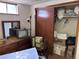 Bedroom with dresser, television, and open closet at 3910 E Orchard Rd, Centennial, CO 80121