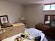 Bedroom with a dresser, mirror, and decorations at 3910 E Orchard Rd, Centennial, CO 80121