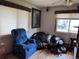 Bedroom with a blue recliner and natural light at 3910 E Orchard Rd, Centennial, CO 80121