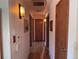 Hallway featuring hardwood floors and light fixtures at 3910 E Orchard Rd, Centennial, CO 80121
