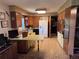Kitchen featuring wood cabinets, retro countertops, and appliances at 3910 E Orchard Rd, Centennial, CO 80121