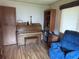 Living room featuring a piano and hardwood floors at 3910 E Orchard Rd, Centennial, CO 80121