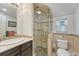 Beautiful bathroom featuring a tiled shower with glass door, a modern vanity, and neutral color scheme at 2215 Meade St, Denver, CO 80211