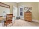 Well-lit bedroom with a desk, dresser, and carpet flooring at 2215 Meade St, Denver, CO 80211