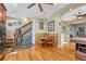 Dining room featuring hardwood floors, a charming dining table, a staircase, and stylish decor at 2215 Meade St, Denver, CO 80211