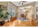 Bright dining room with hardwood floors, large window, and view to the kitchen at 2215 Meade St, Denver, CO 80211