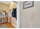 Traditional entryway with hardwood floors, coat rack, and framed picture on wall at 2215 Meade St, Denver, CO 80211