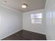 Bedroom with white walls, a large window, and hardwood floors at 3531 E 122Nd Ave, Thornton, CO 80241