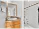 Clean bathroom featuring a vanity with a mirror, a toilet, and a shower-tub combination at 8826 E Florida Ave # 117, Denver, CO 80247