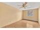 Cozy bedroom showcasing natural light, complemented by wood floors and soft yellow walls at 8826 E Florida Ave # 117, Denver, CO 80247