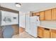 Open kitchen area with view into living room and featuring essential appliances at 8826 E Florida Ave # 117, Denver, CO 80247
