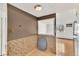 Transitional space featuring tiled flooring and a view into the living room and bedroom at 8826 E Florida Ave # 117, Denver, CO 80247